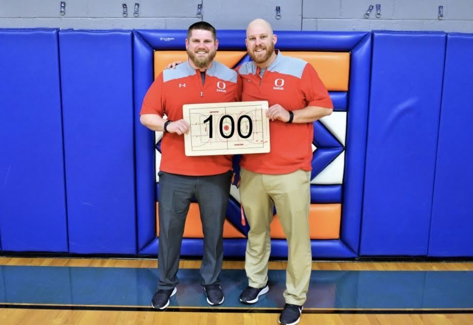 Coach Mitchell celebrates his 100th win with assistant Coach Eisenhauer