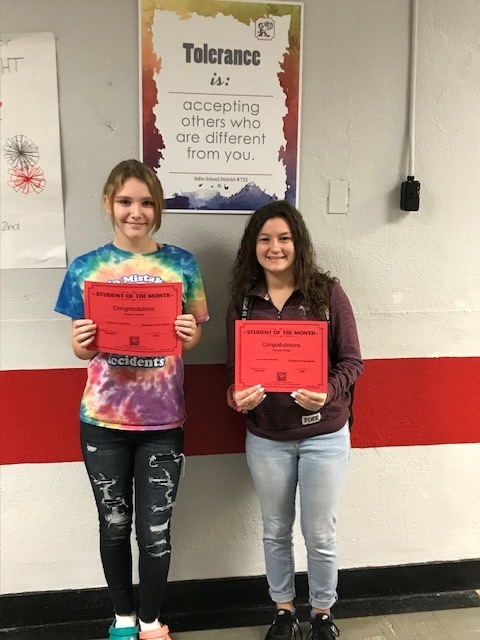 Autumn Wiese and Kendra Hodge holding certificates for student of the month